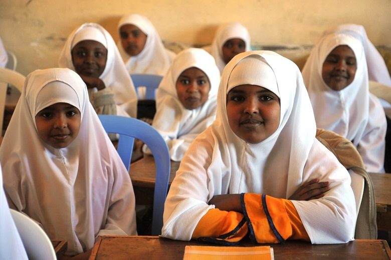 Smiling schoolgirls in a classroom in Mandera