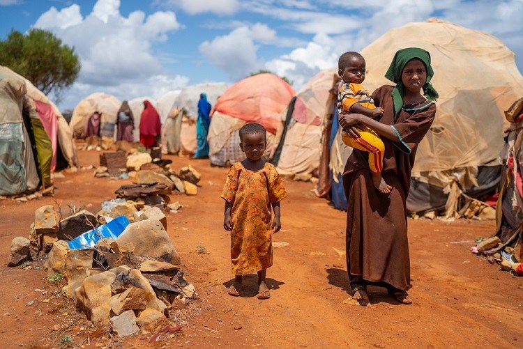Mother and children outside their home in a settlement in Mandera County